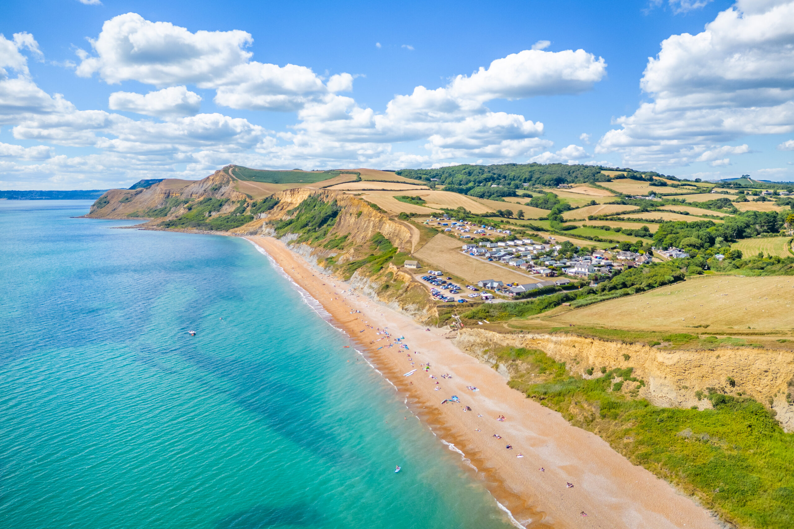 drone shot of beach and wdlh holiday park
